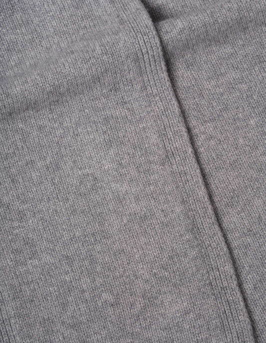 Light grey knitted cashmere scarf, fabric swatch.