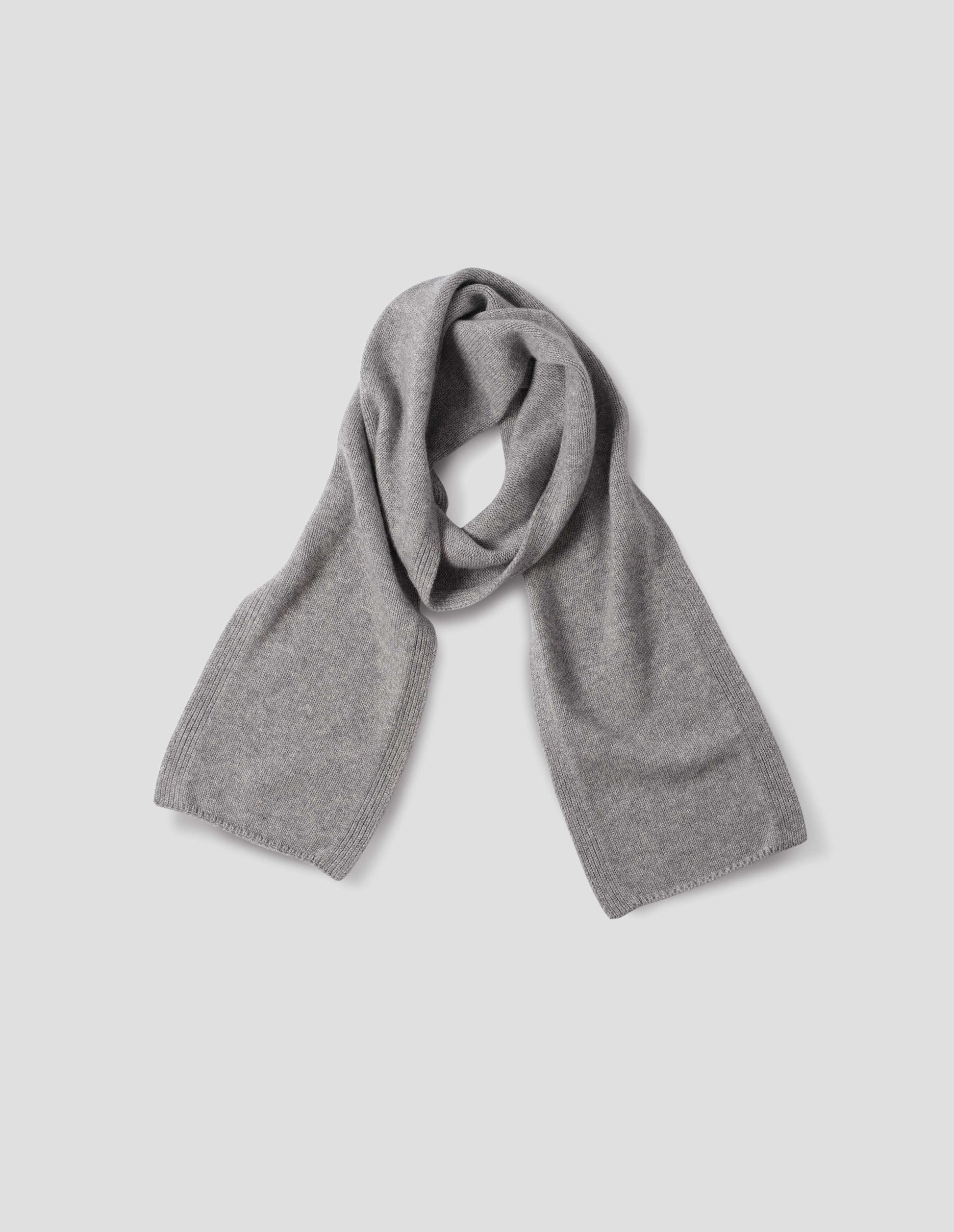 Light grey knitted cashmere scarf, front flat lay view.