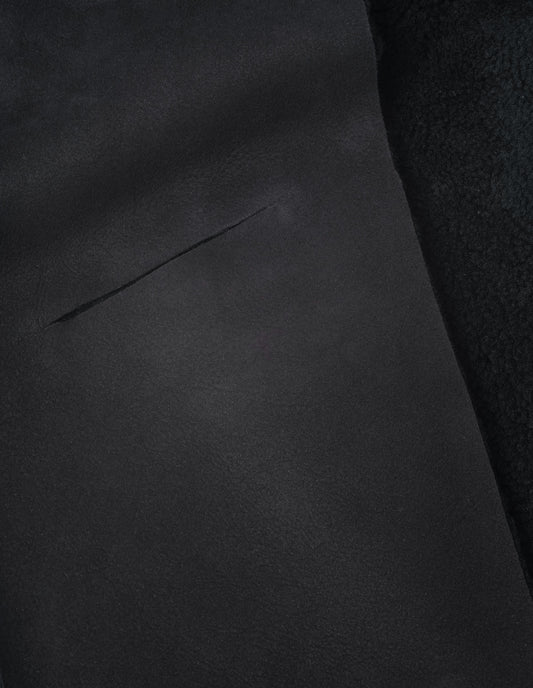 Black curly merino shearling scarf fabric swatch.