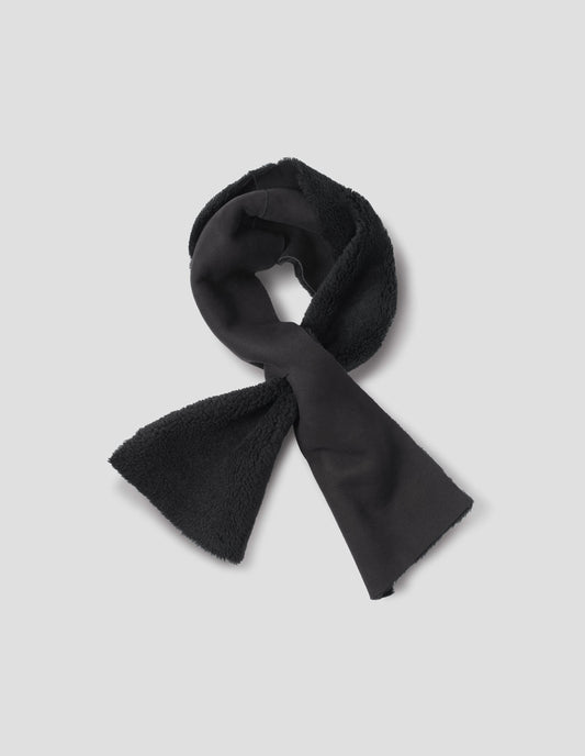 Black shearling tie through scarf with raw edge. Front flat lay view. 