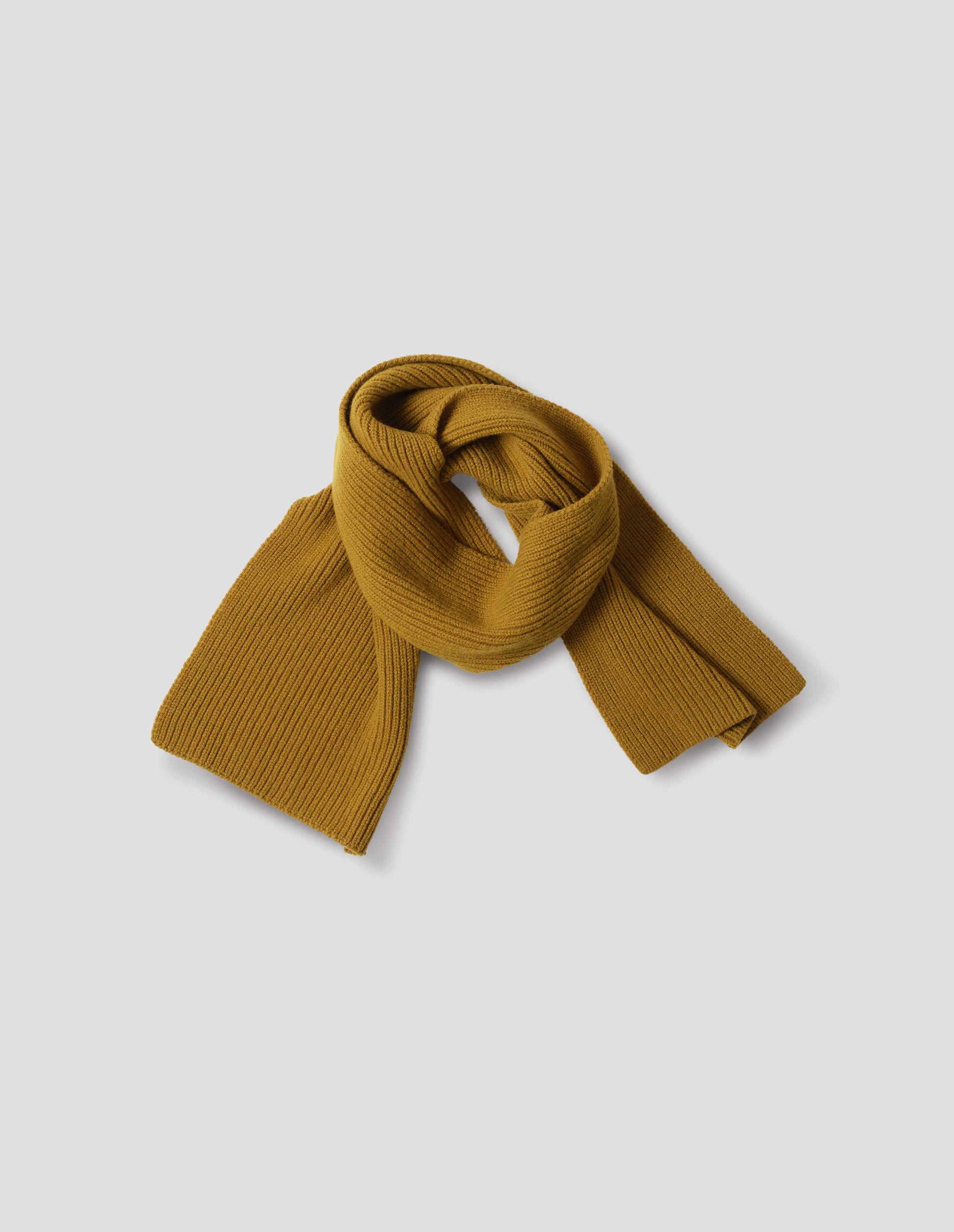 Yellow rib knitted merino wool scarf, front flat lay view. 