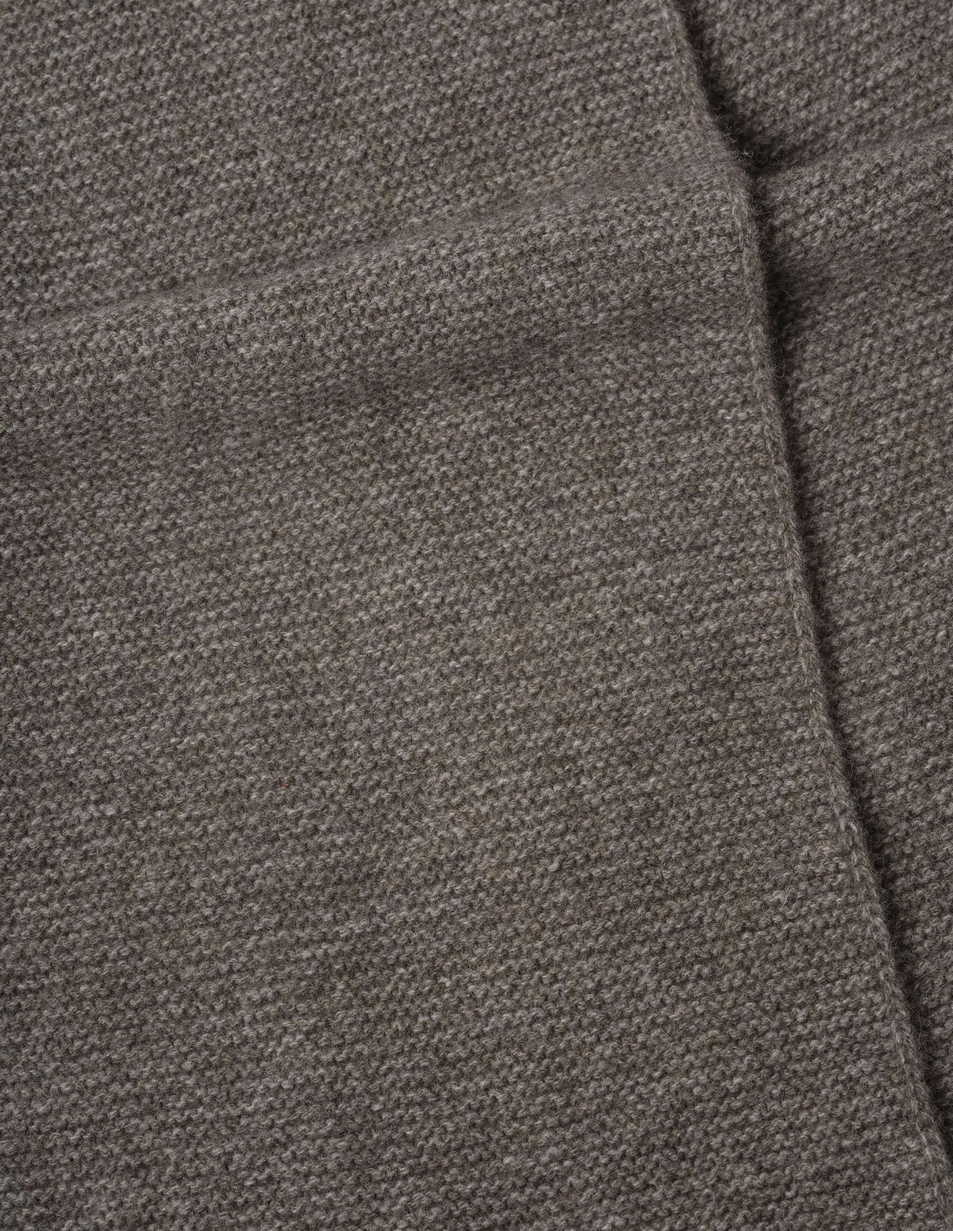 Beige brown textured knitted yak, wool and cashmere scarf, fabric swatch.