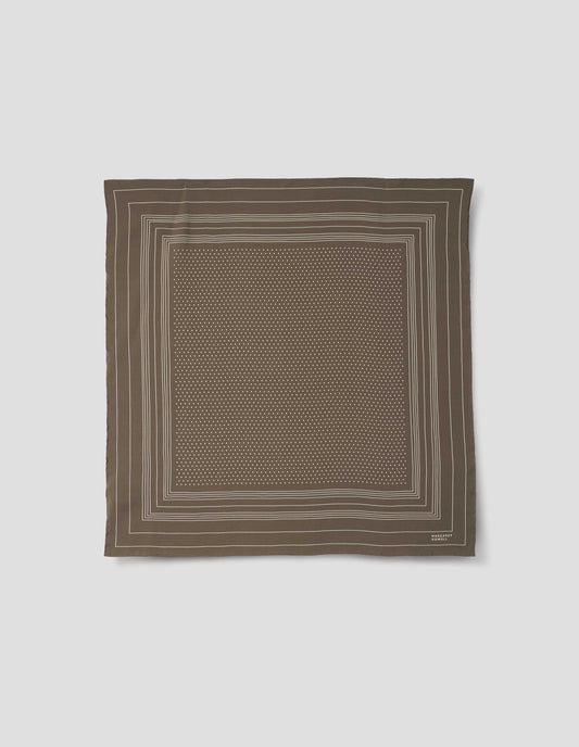 Khaki green square silk neck scarf with white border stripes with white dots inside, hand rolled edges and white Margaret Howell logo in right corner. Front flat lay view.