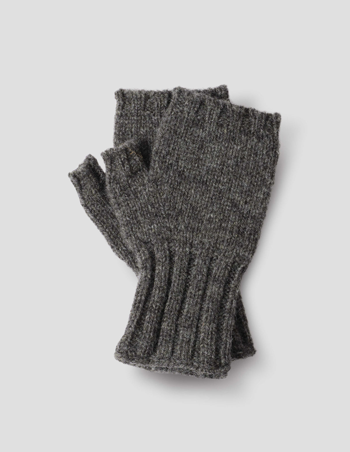 Grey knitted Shetland wool fingerless gloves with contrasting rib cuffs, front flat lay view.