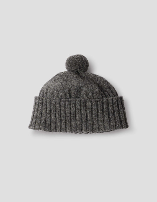 Grey knitted Shetland wool bobble hat with rib turned up cuff, front flat lay view.