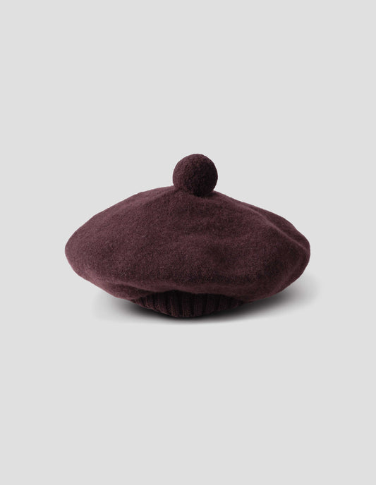 Dark brown wool tam o shanter hat with matching pom pom in centre, side view.