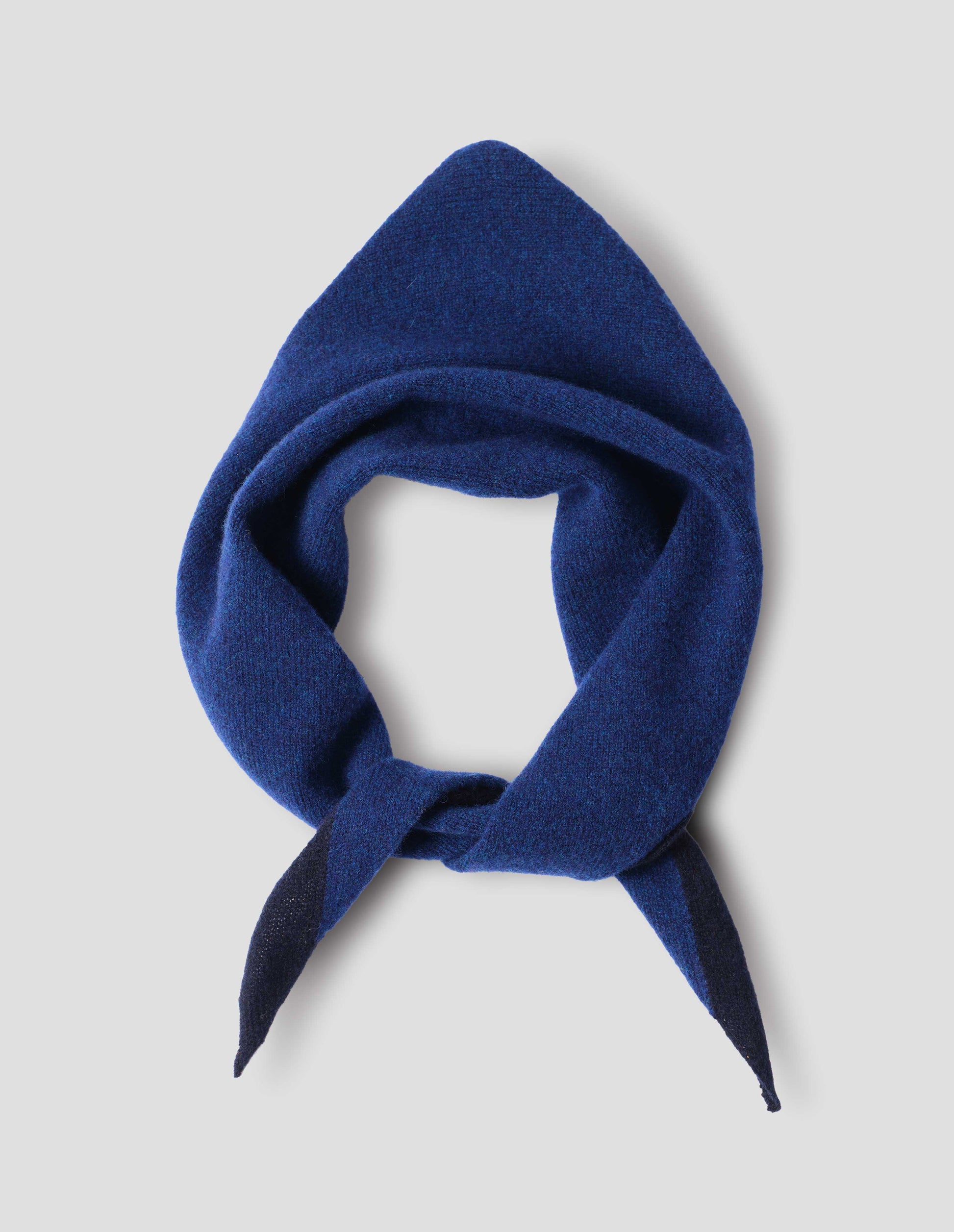 Blue wool scout scarf with dark navy wool trim, front flat lay view.
