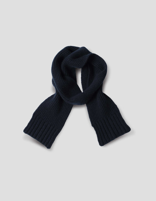 Dark navy knitted ribbed cashmere scarf, front flat lay view.