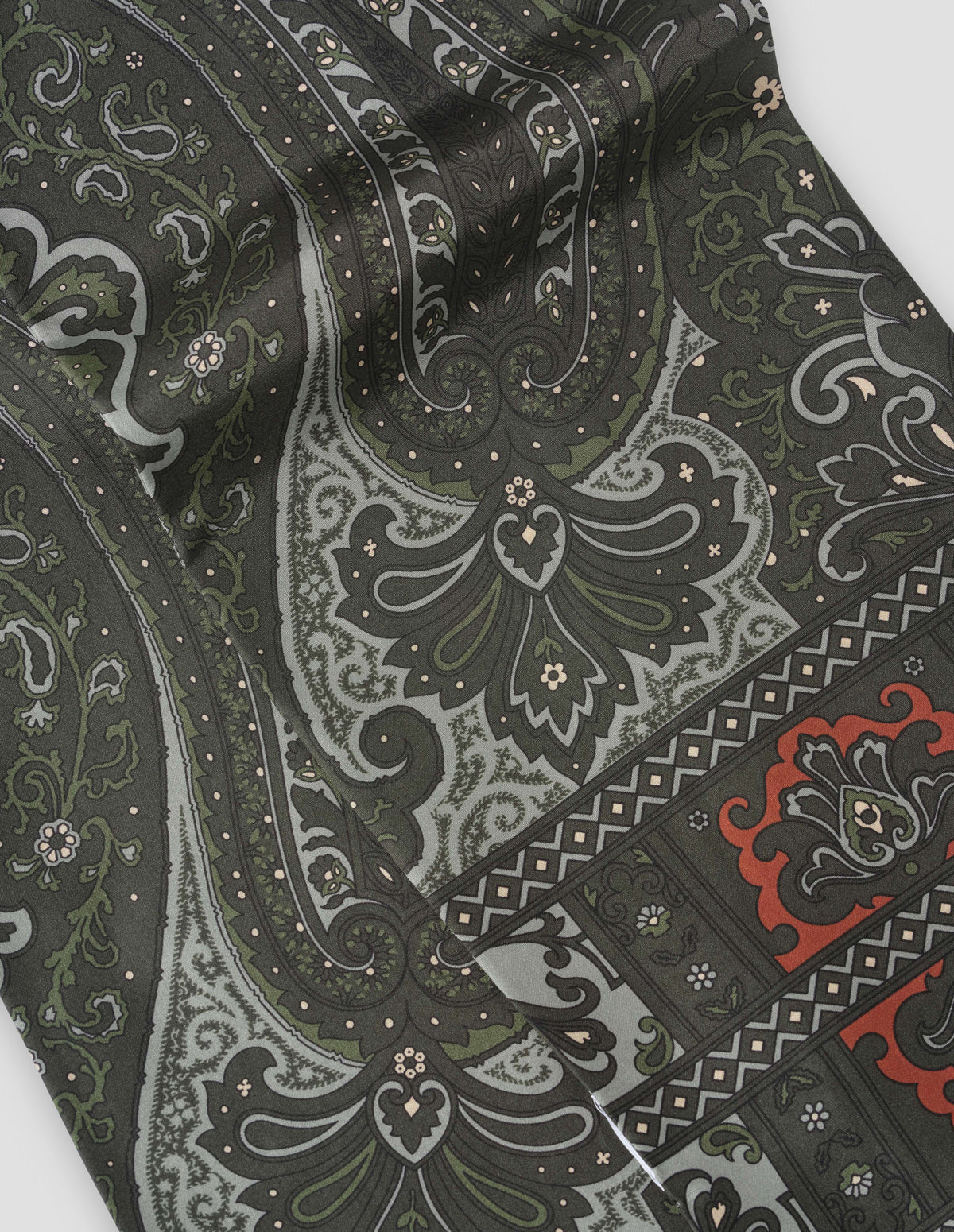 Dark green silk scarf with orange, green and light blue paisley scarf, fabric swatch.
