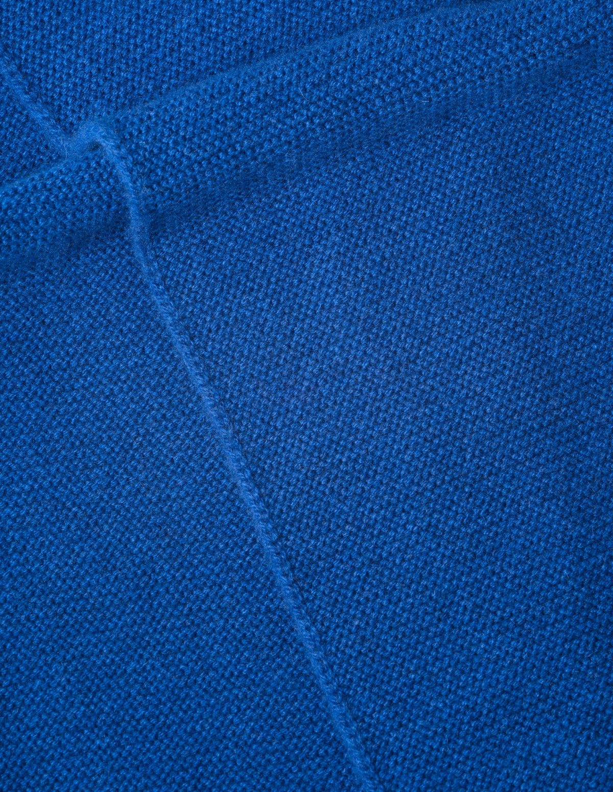 Blue merino cashmere knitted scarf fabric swatch.