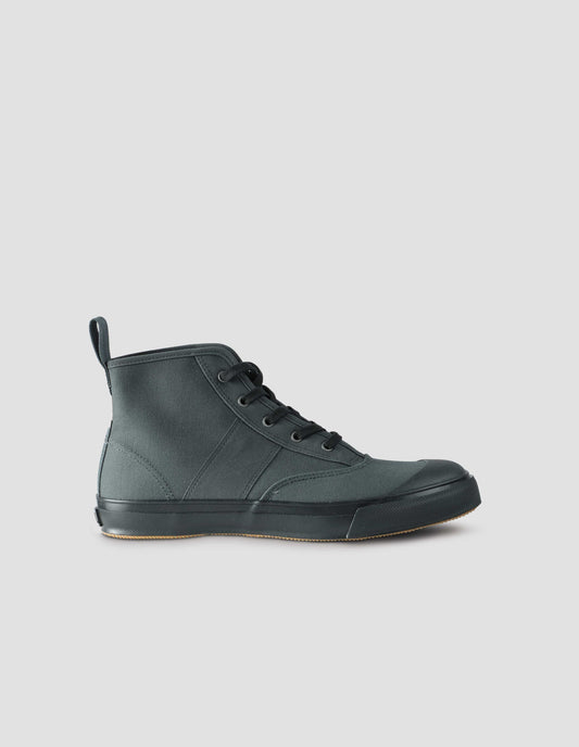 A single greenish grey high top canvas trainer with metal eyelets, contrasting black laces, canvas heel loop and contrasting black rubber sole. Side view flat lay.