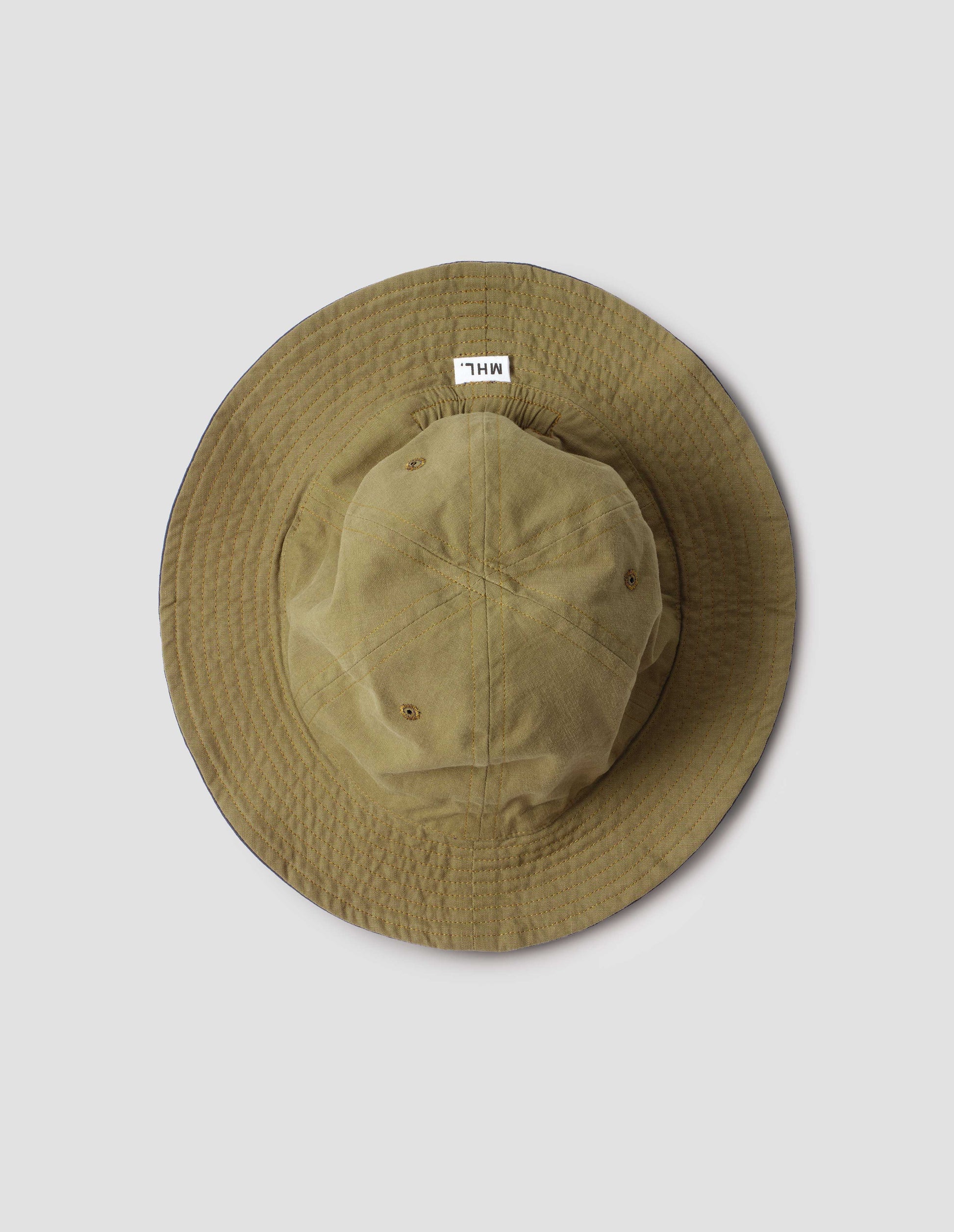 Reverse side Olive cotton hat showing stitching detail on brim and MHL. label. Bird's eye flat lay view.