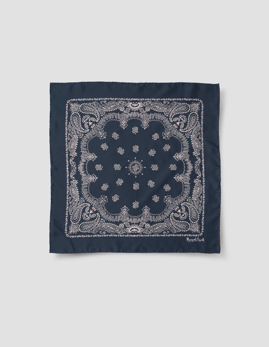 Navy blue square neck scarf with contrast white paisley pattern and Margaret Howell signature in bottom right corner. Front flat lay view.