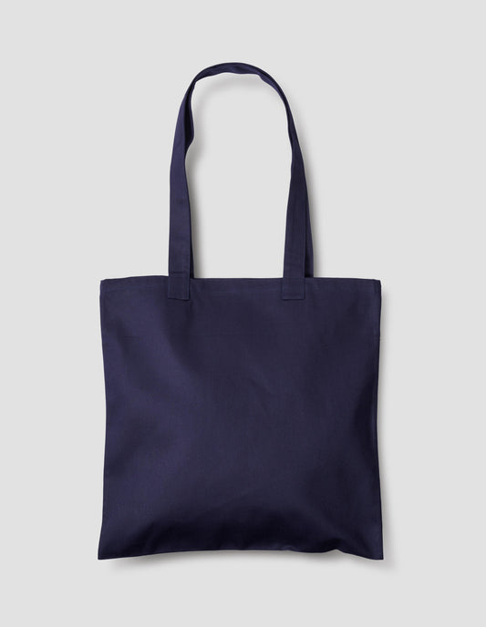 Navy blue cotton tote bag. Back flat lay view.