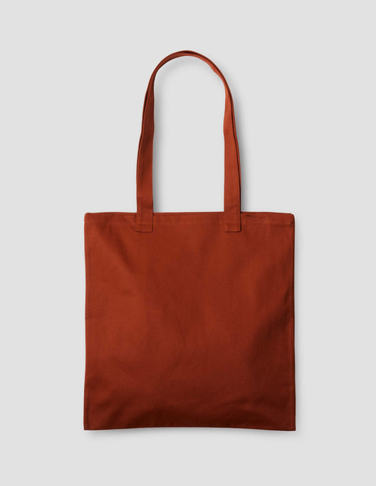Reddish orange cotton tote bag. Back flat lay view.