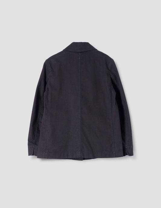 Indigo twill single breasted blazer, with fold back split cuff and curved hem. Back flat lay view.