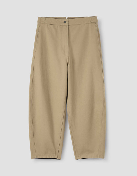 Beige trousers with zip fly and button through fastening, side cinch adjusters on waistband and concealed side pockets. Front flat lay view. 