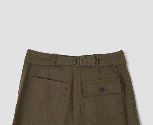 Green cotton wool trousers with self waistband with cinch back and belt loops, button through flap patch and patch back pockets. Back flat lay view.