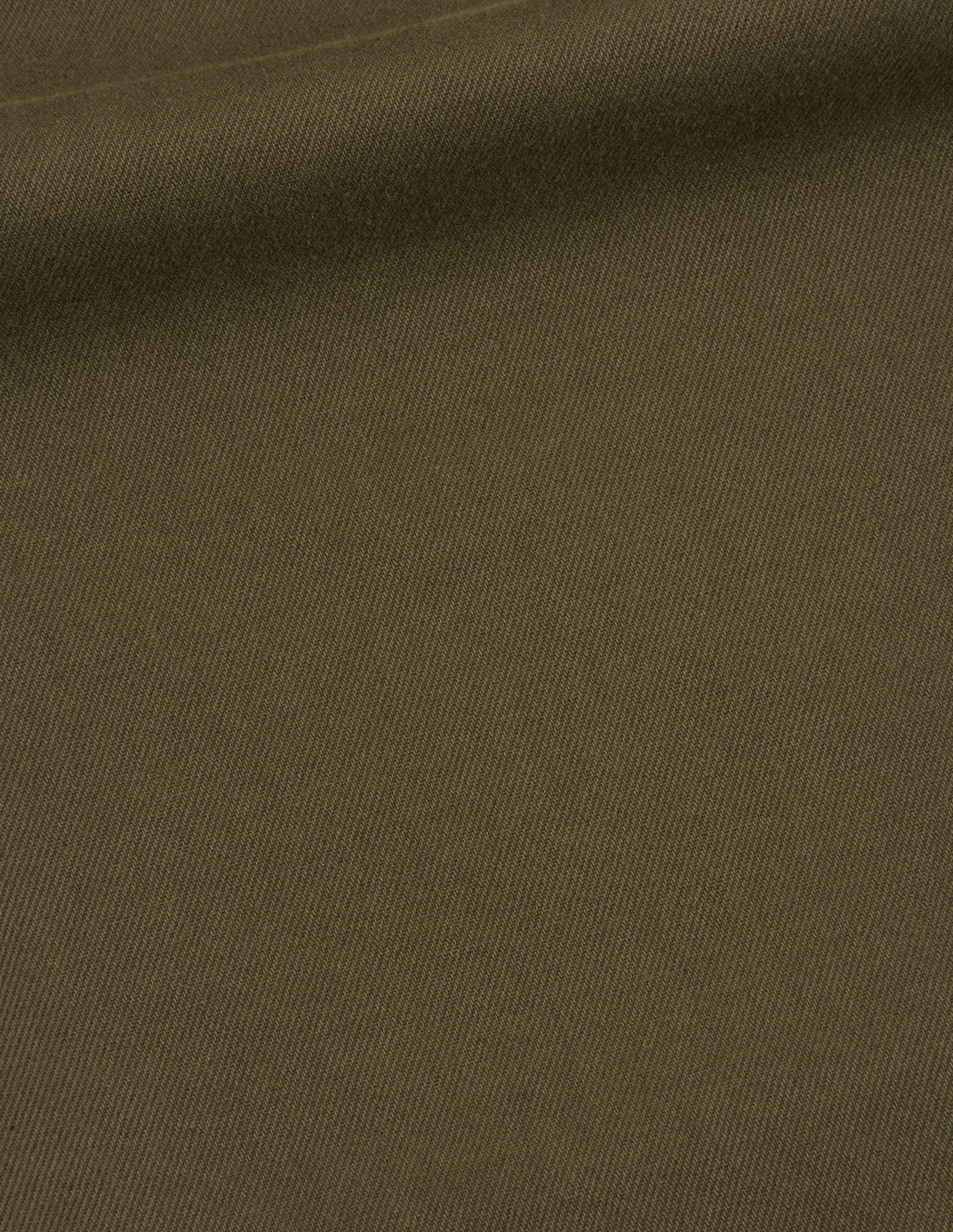 Green cotton wool drill trousers, fabric swatch.