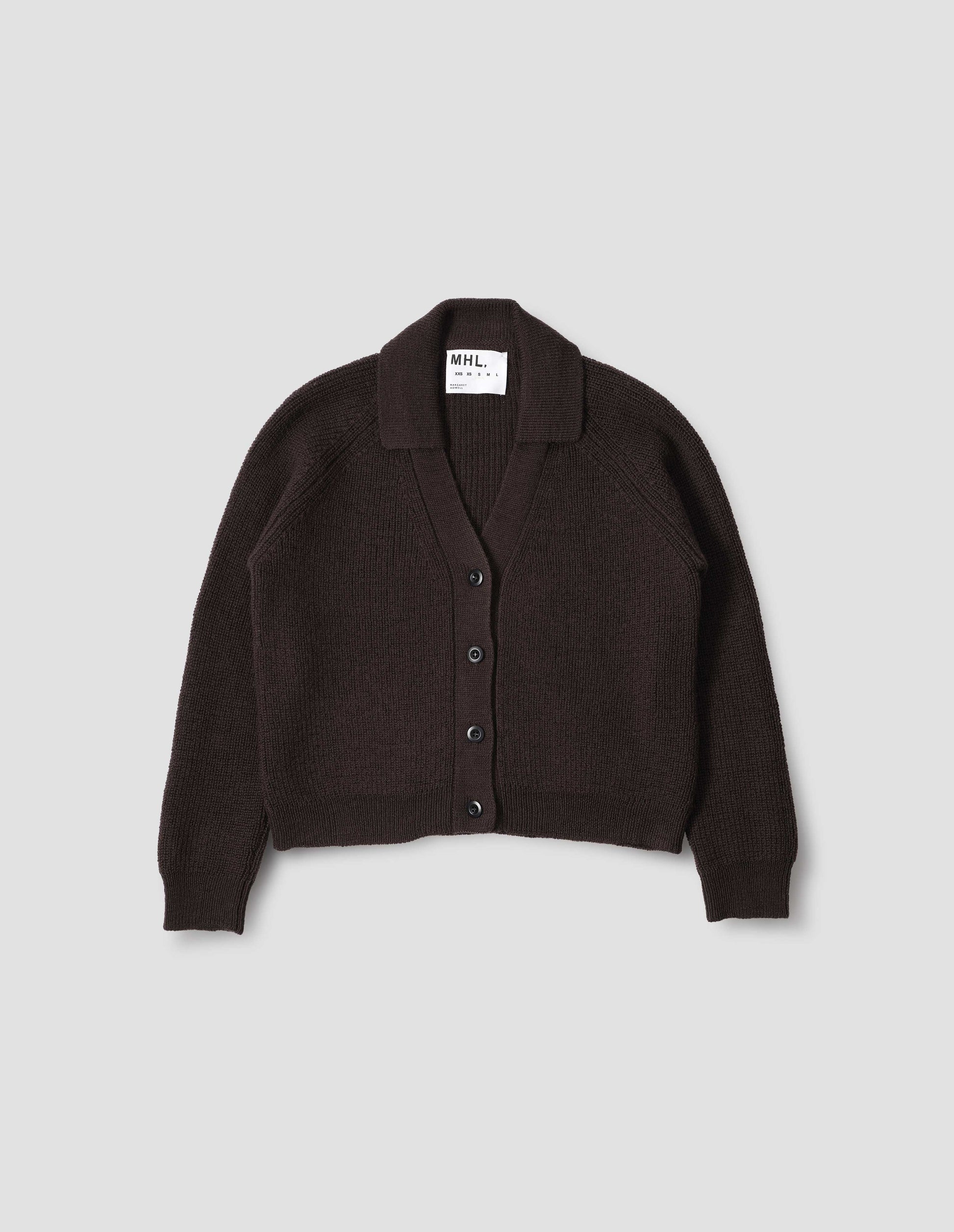 Brown wool collared cardigan with raglan sleeve, contrast rib on collar, placket and hem and corozo brace button closure. Front flat lay view.