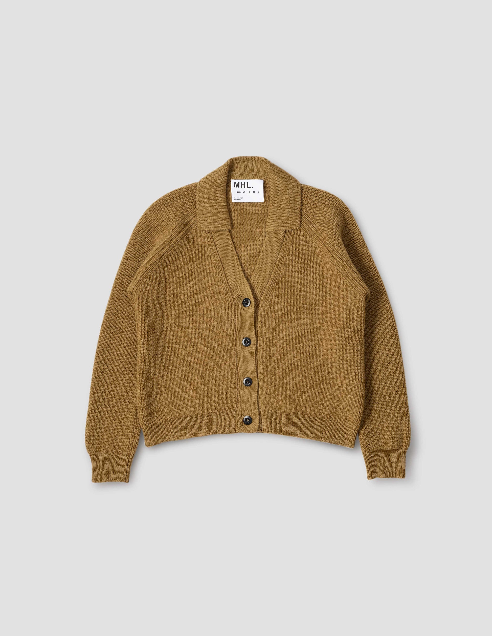 Yellow  wool collared cardigan with raglan sleeve, contrast rib on collar, placket and hem and corozo brace button closure. Front flat lay view.