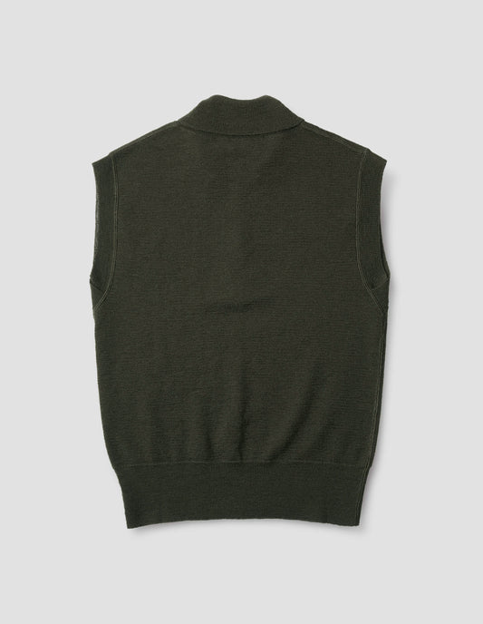 Dark green wool slipover, with half zip mock turtleneck and flatlock stitch detailing on seams. Back flat lay view.