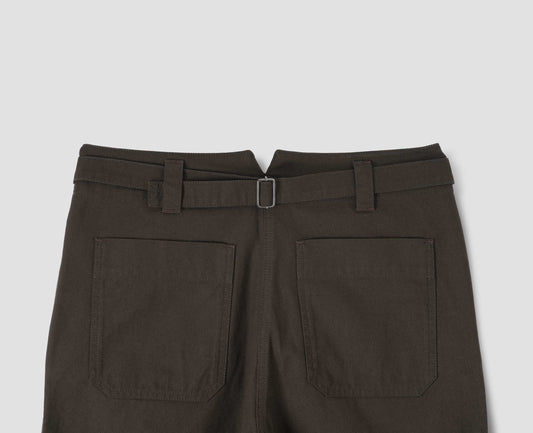 Dark brown cotton trousers with stitch through waistband, cinch back fastening with belt loop detail and patch back pockets. Back flat lay view.