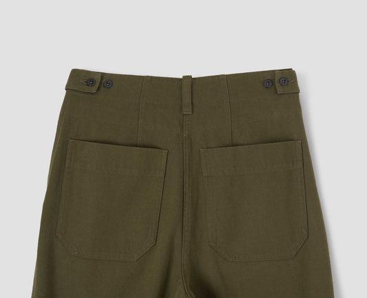 Green cotton wool trousers with button tab side adjusters, belt loop and patch back pockets. Back flat lay view.
