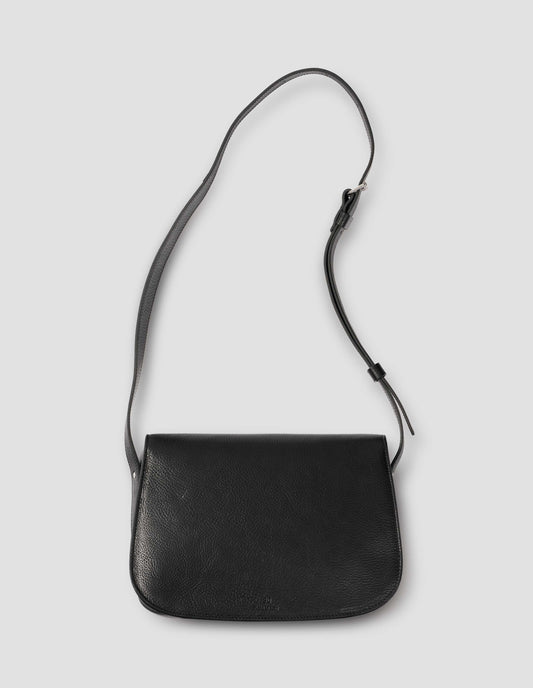 Black fine grain leather satchel bag with adjustable shoulder strap. Back flat lay view. 