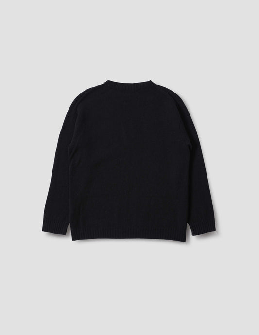 Black merino cashmere bed jumper with raglan sleeve and contrast rib on neck, cuffs and hem, Back flat lay view.