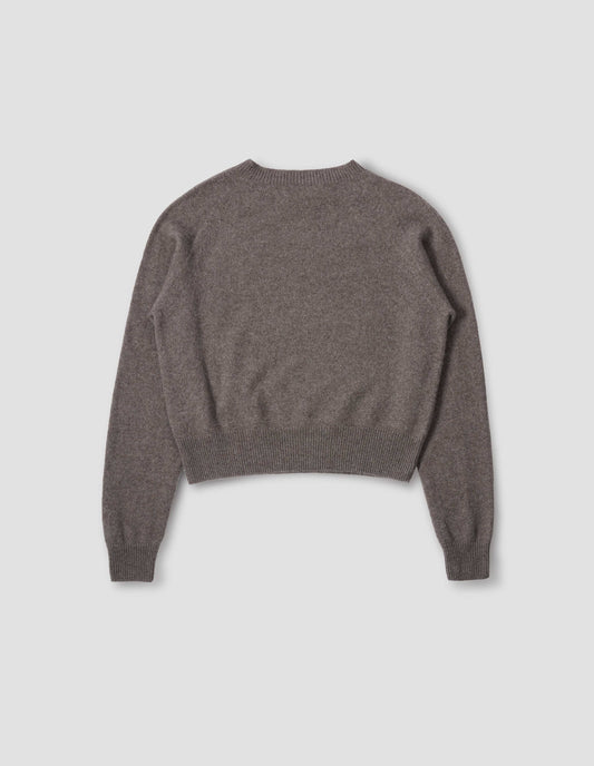 Greyish beige jumper with raglan sleeve, contrast rib on neck, cuffs and hem. Back flat lay view.