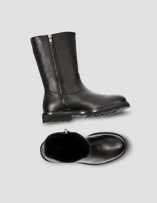 Black leather three quarter length boots with side zip, Vibram sole and shearling lining. View from above flat lay.