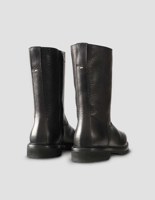 Black leather three quarter length boots with Vibram sole and shearling lining. Back view flat lay.