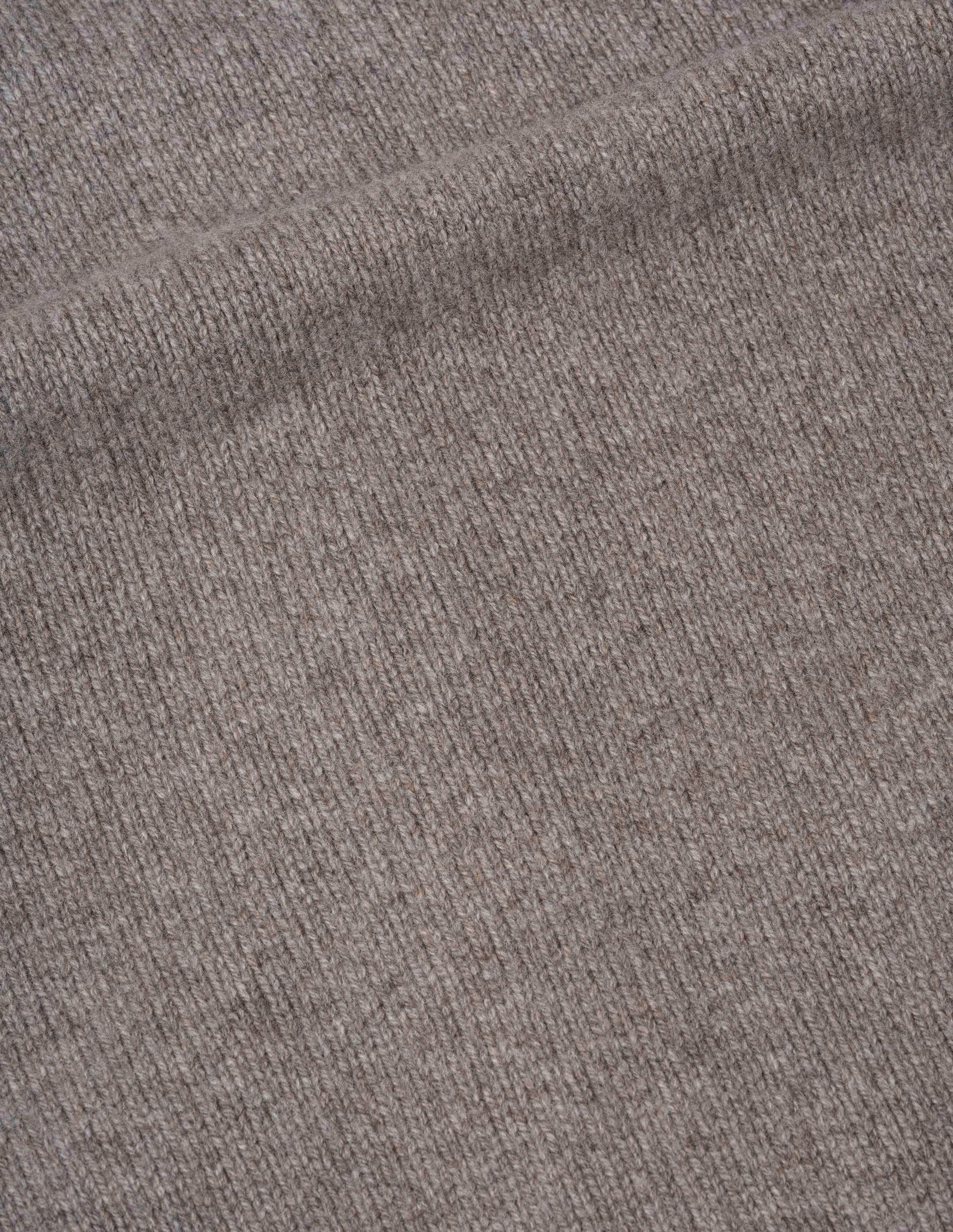 Beige v-neck cardigan lambswool, fabric swatch.