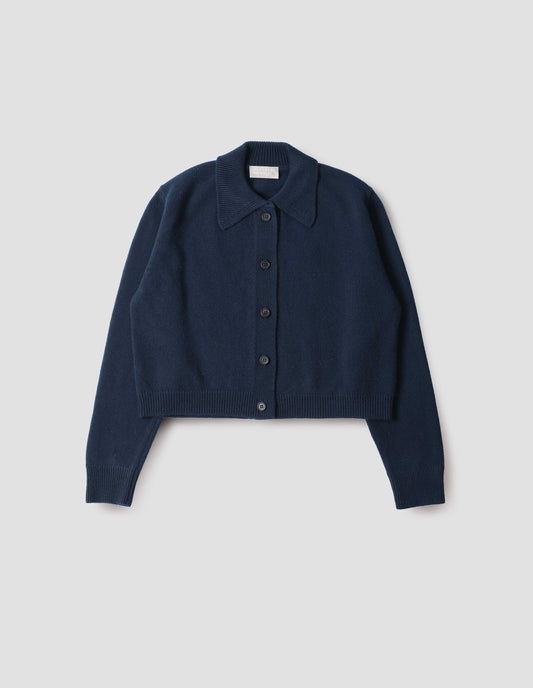 Dark blue boxy cardigan with collar, horn buttons and contrast rib on collar, cuffs and hem, front flat lay view.