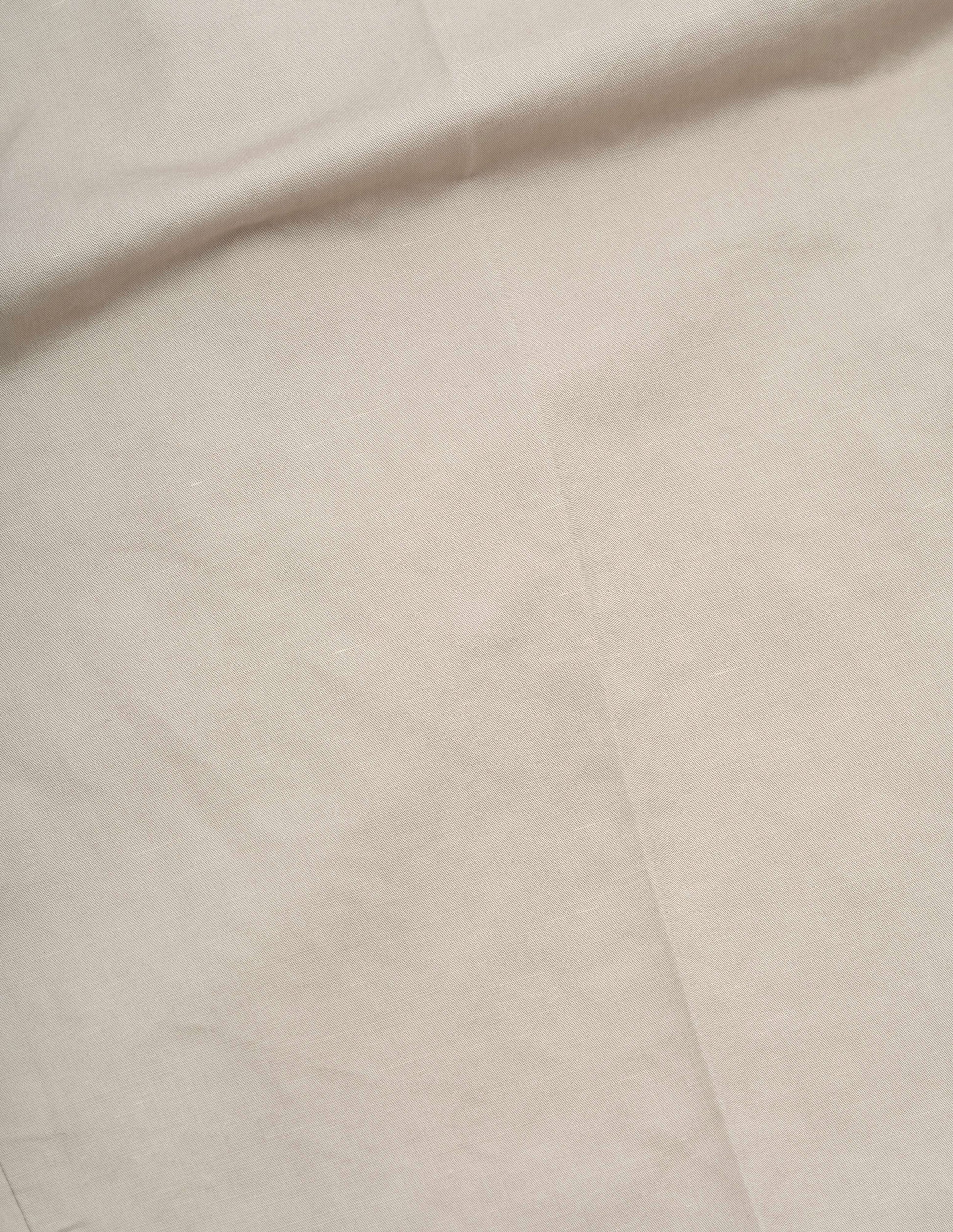 Beige cotton linen twill trousers fabric swatch.