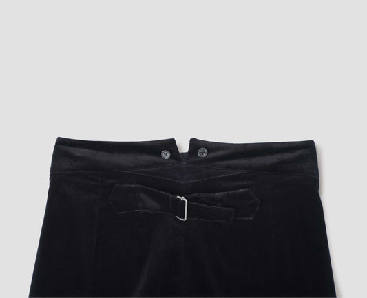 Black high waisted trousers with double horn button details on waistband and cinch back, back flat lay view. 