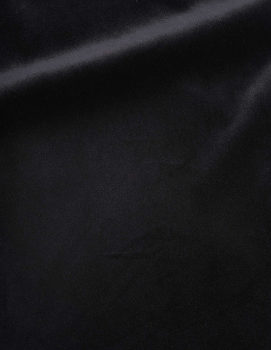 Black rich cotton velvet trousers fabric swatch.