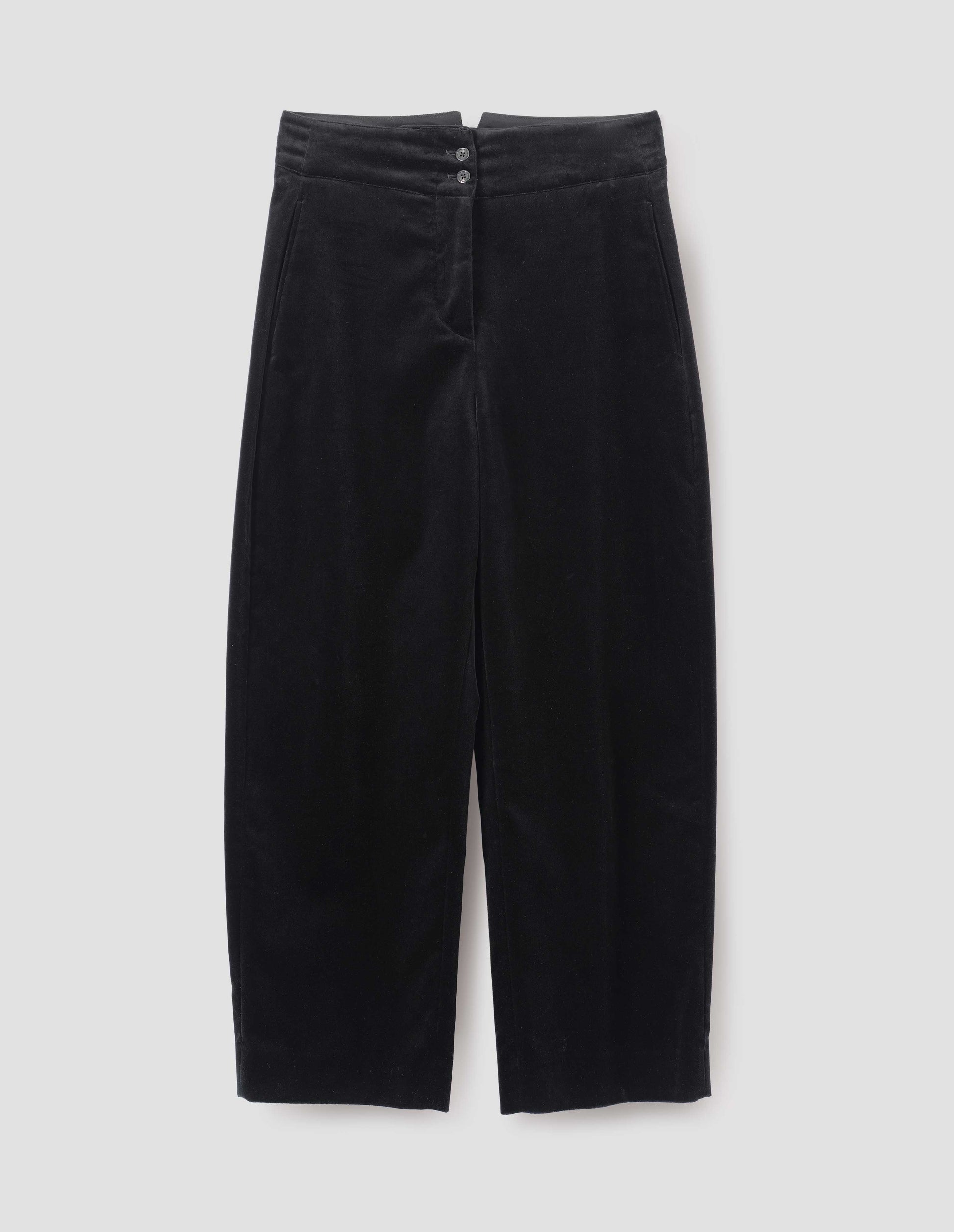 Black high waisted trousers with horn buttons and side pockets, front flat lay view. 