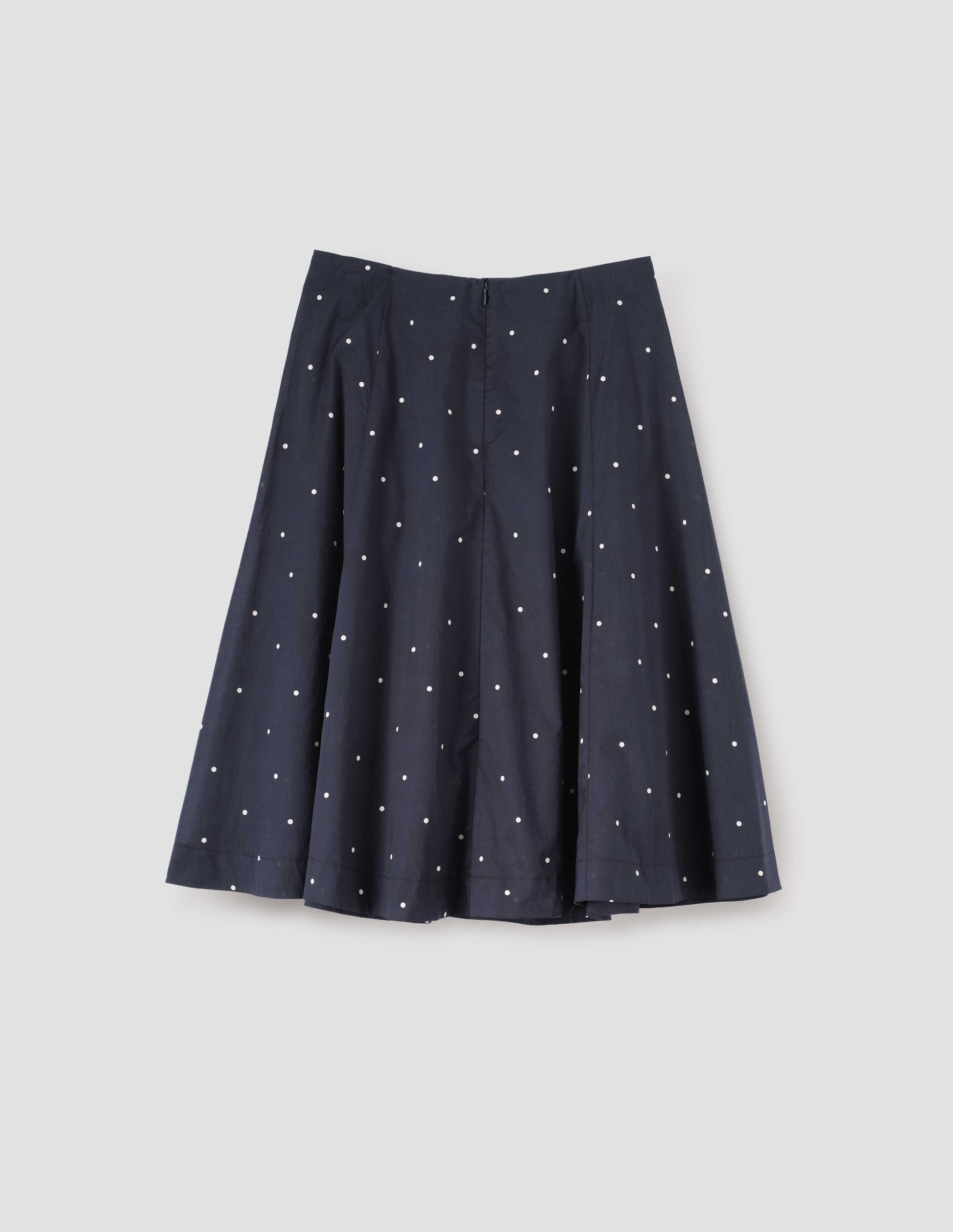 Navy blue and white polka dot flared skirt, with concealed centre back zip fastening. Back flat lay view.