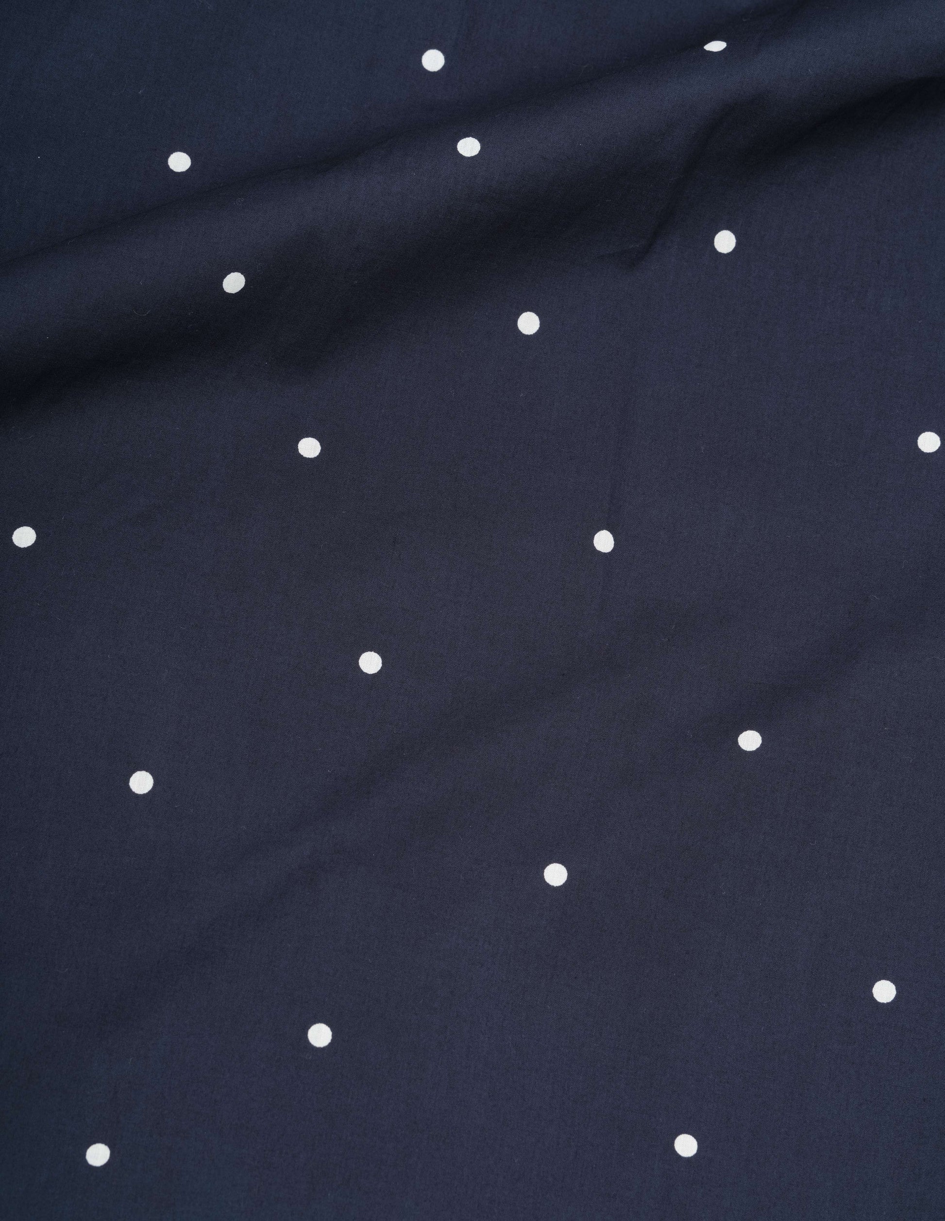 Navy blue and white cotton polka dot flared skirt, fabric swatch.