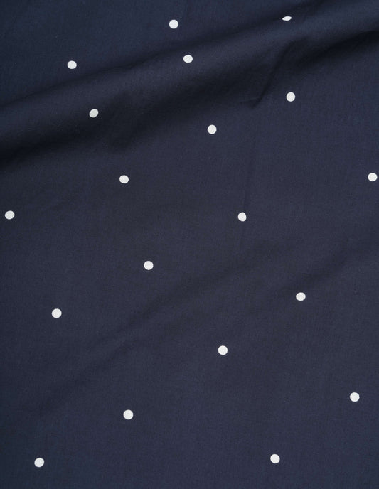 Navy blue and white cotton polka dot flared skirt, fabric swatch.