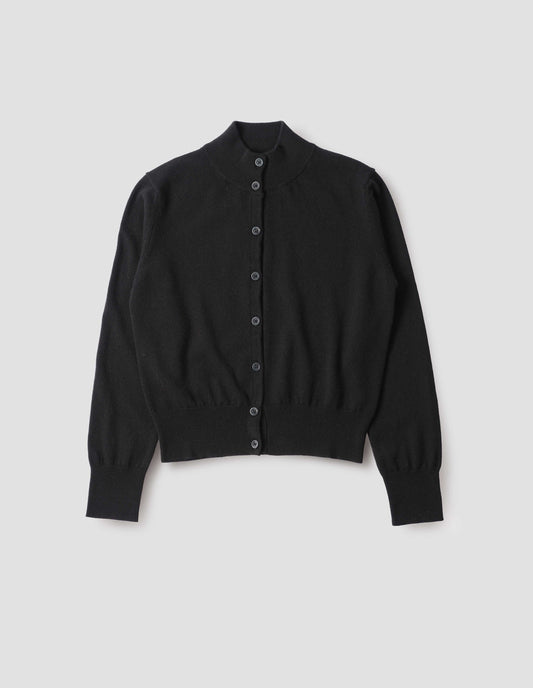 Black mock neck cardigan with horn shirt buttons, ribbed collar, cuffs and hem, front flat lay view.