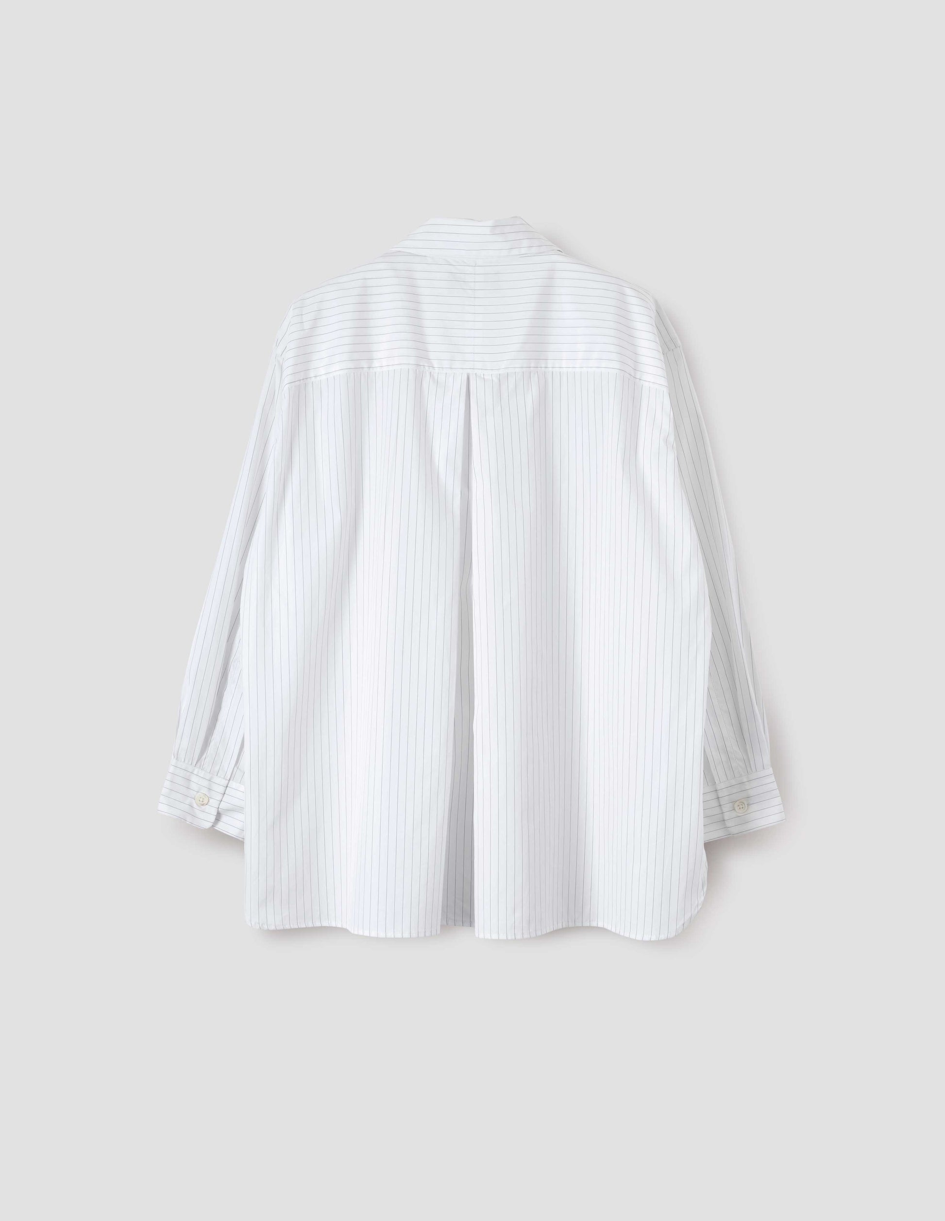 White and grey striped shirt with A line hem, split panel yoke with deep, inverted centre back pleat and mother of pearl buttons on cuffs. Back flat lay view.