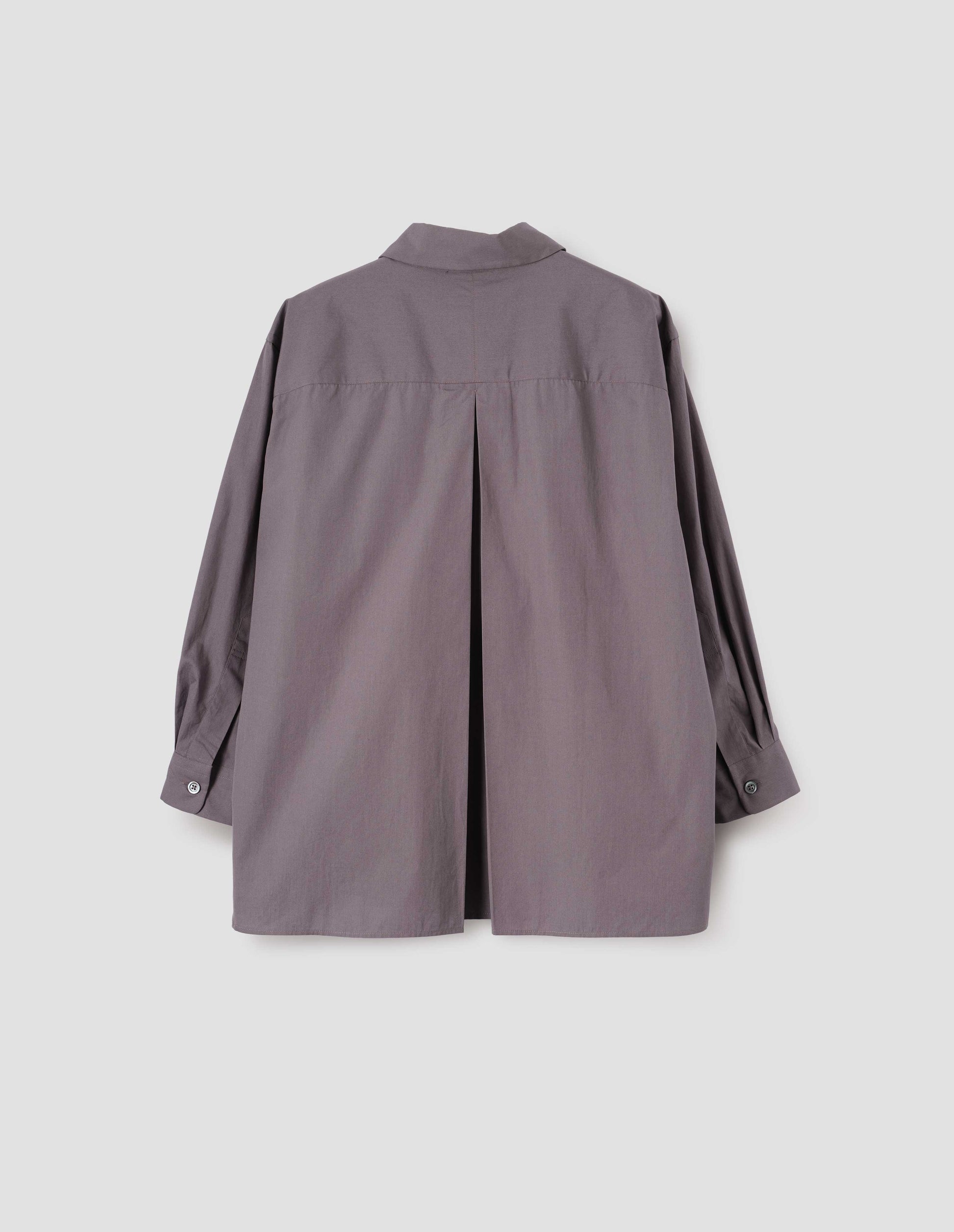 Brown shirt with A line hem, split panel yoke with deep, inverted centre back pleat and mother of pearl buttons on cuffs. Back flat lay view.