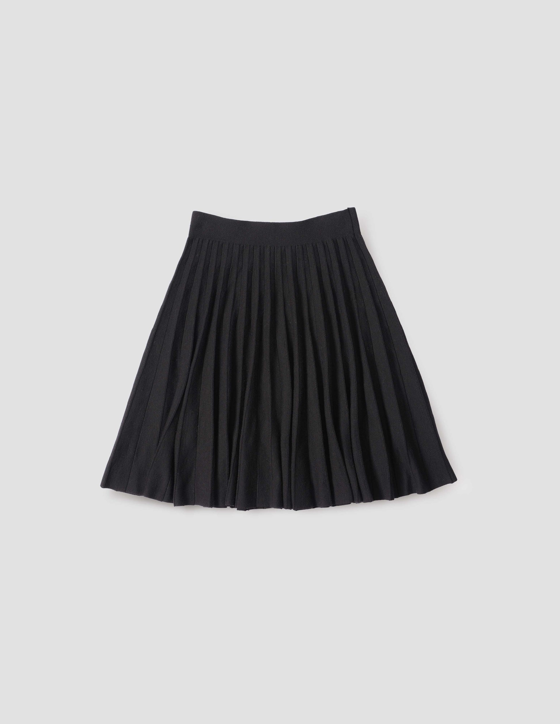 Black knitted skirt with pleats. Front flat lay view.