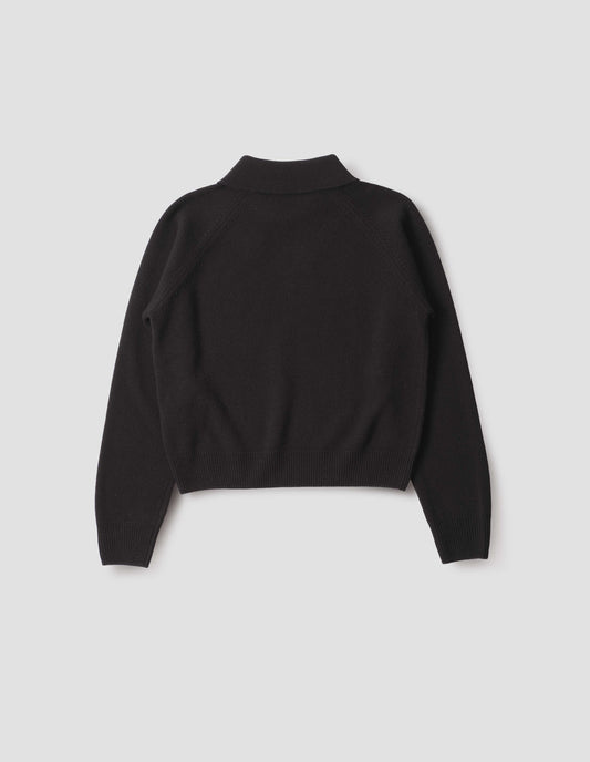 Black collared jumper with contrast rib on cuffs and hem, back flat lay view.