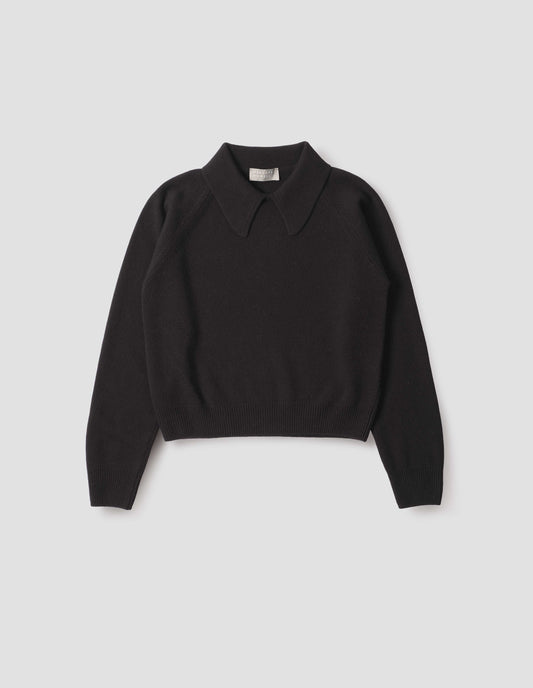 Black collared jumper with contrast rib on cuffs and hem, front flat lay view.