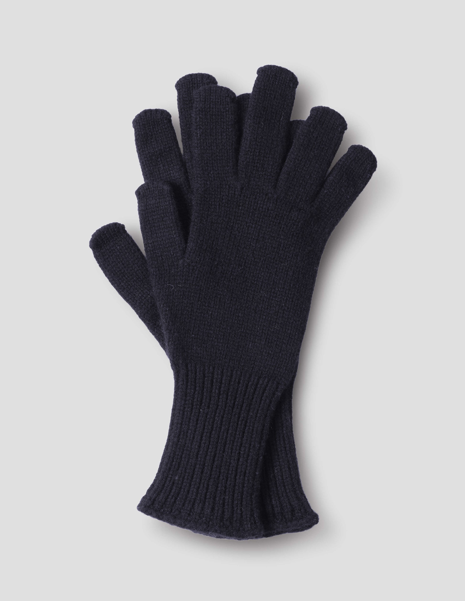 Dark blue knitted cashmere gloves with long ribbed cuffs. Front flat lay view.