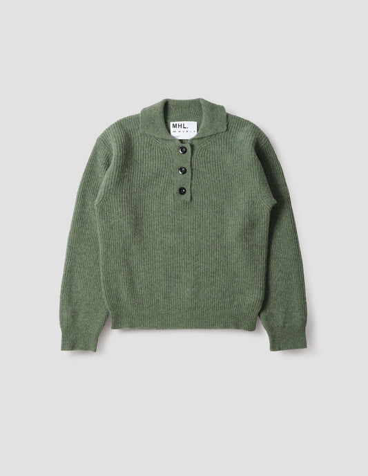 Green knitted polo with black corozo brace buttons and contrast rib on collar, placket and cuffs, front flat lay view.
